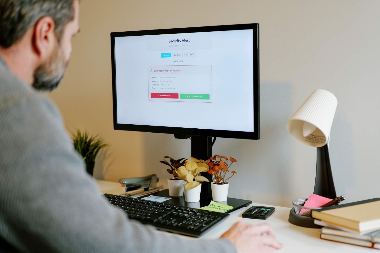 A computer screen displays a security alert for a suspicious sign-in attempt