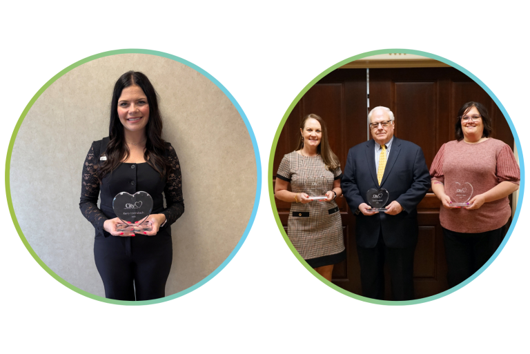On the left, a woman stands holding a heart-shaped award. On the right, two women and a man stand together, each holding an award.